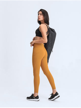 Millennia Wide Waistband Leggings with Pockets Trendsi